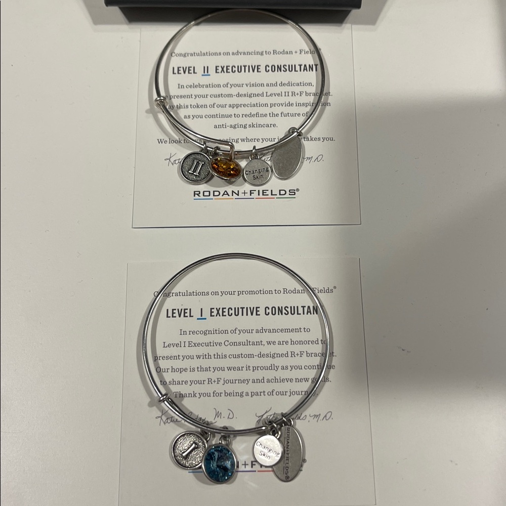 Rodan + Fields Silver Charm Bracelets (2) with Blue and Amber Accents